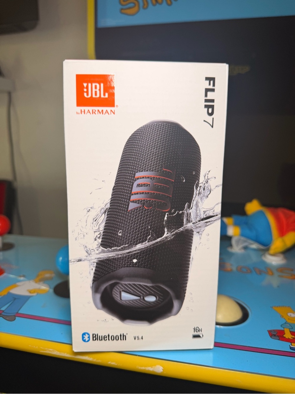 JBL Flip 7 Portable Bluetooth Speaker - Black with Orange Logo